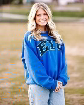 A person in a blue sweatshirt

Description automatically generated